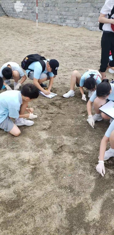 Hunting for Nurdles at Hac Sa.jpg